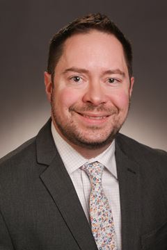 A photo of Grant Schulert.