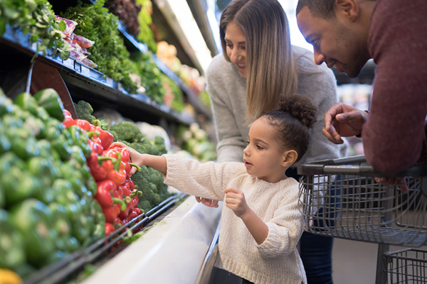 A family shopping for produce.
