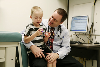 health care provider with child.