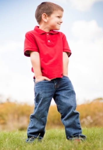 Child standing in a field