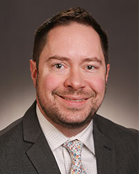 A photo of Grant Schulert, MD, PhD.
