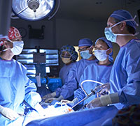 Director of the Peña Colorectal Center, Jason Frischer, MD (far right) leads a recent surgery.